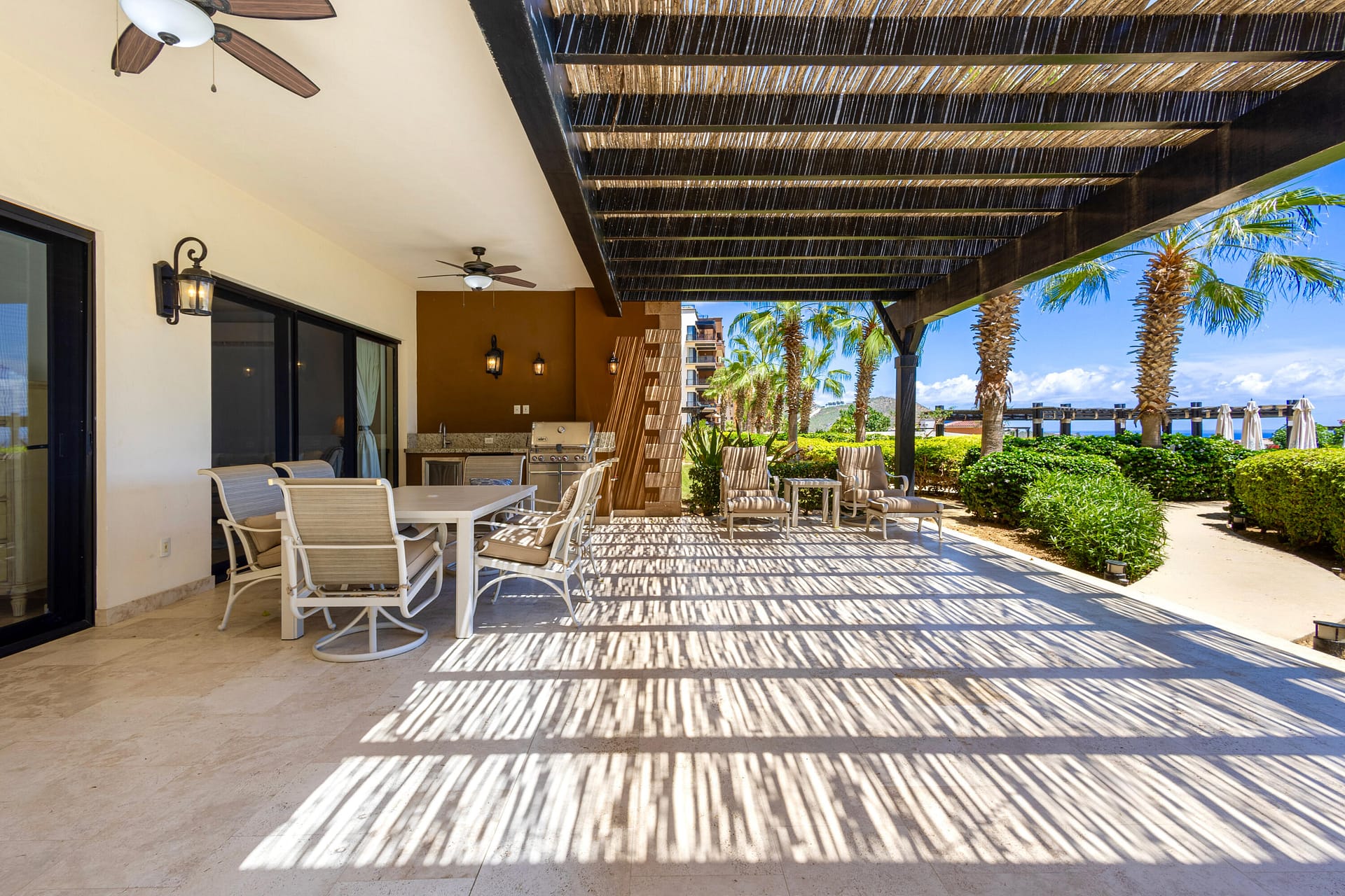 Welcome to Copala Unit 3101 — a rare ground-floor 3BR/3BA gem with the largest private terrace in all of Copala. Here you can enjoy effortless living with no stairs or elevators, and two private parking spots. Wake up to a stunning blue line view of the Pacific from the elegantly furnished primary suite. The spacious, ocean-view terrace features a full outdoor kitchen with grill, bar sink, and fridge, plus room for a hot tub, and/or fire pit. Just steps from  the pool, yet enhanced with an extended privacy wall and private garden off the second bedroom. Inside, coastal elegance meets functionality with custom cabinetry, safety bars, upgraded appliances, and a layout designed for both comfort and entertaining. A true retreat offering unmatched space, privacy, and ocean-view living.