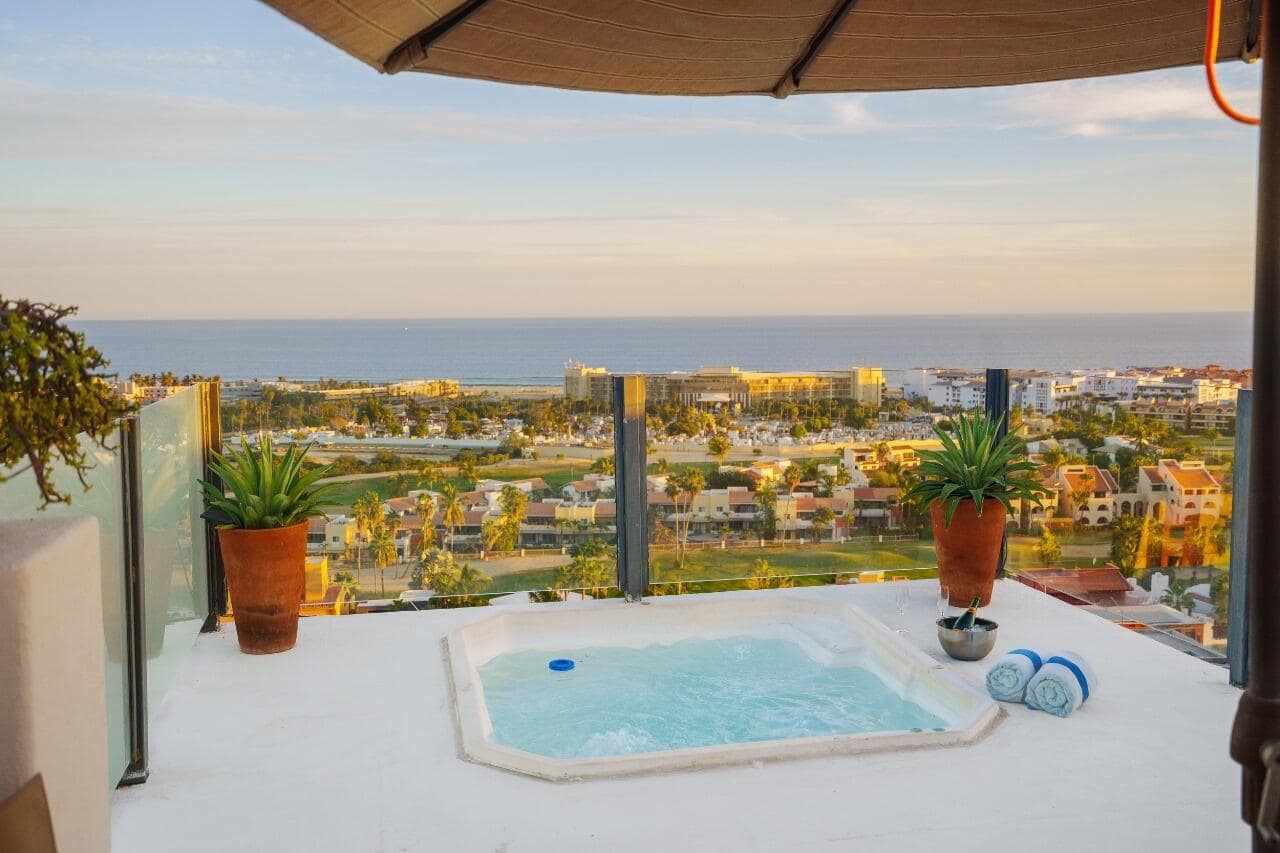 Discover Alegranza's Best View CondoExperience this stunning two-story corner condo perched on the top floor, offering breathtaking 270° views of the city and the ocean.The private rooftop terrace is an oasis of relaxation, featuring a Jacuzzi, grill, sink, and spacious living and dining areas—the perfect setting to embrace the Cabo lifestyle.Inside, you'll find two bedrooms with full en-suite bathrooms and wraparound closets, plus underground parking and elevator access for your convenience. This is the most naturally lit unit in Alegranza, surrounded by expansive terraces that invite sunlight all day long. Owners and guests also enjoy access to renovated pools, a tennis court, mini-golf, a fire pit, and full concierge service. ndulge in the flavors of Alegranza's new restaurant.